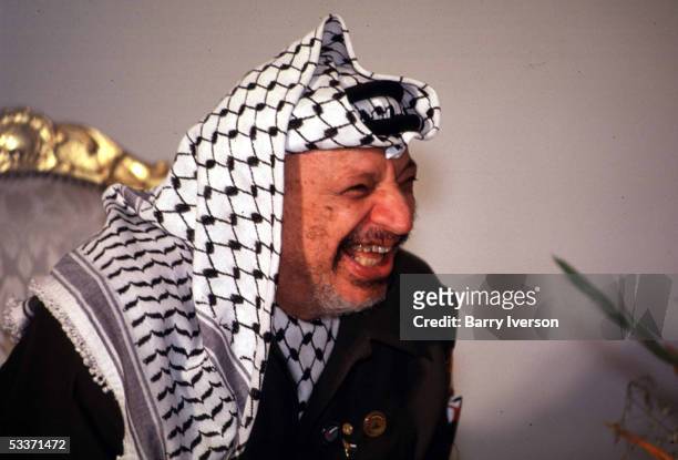Palestinian Liberation Organization, or PLO, leader Yasser Arafat laughing during a meeting with Egyptian President Mubarak.