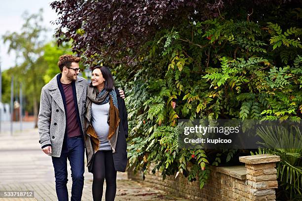 taking baby to be for a walk - young couple with baby stock pictures, royalty-free photos & images