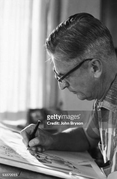 Children's author Theodor Geisel, aka Dr. Seuss, making an illustration for an upcoming book.