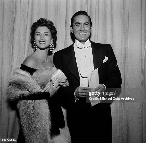 Actor Tyrone Power and his wife actress Linda Christian attend the Academy Awards in Los Angeles,CA