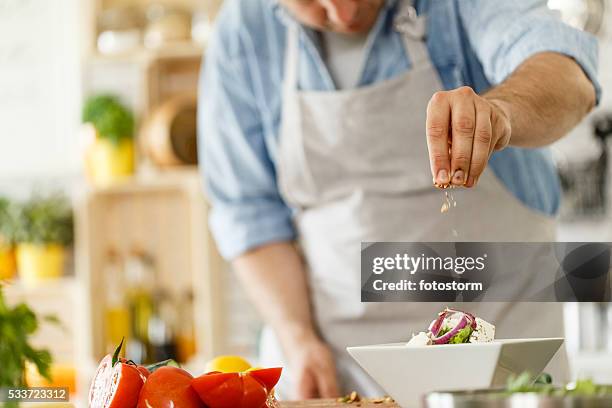 chef decorating a plate with healthy salad - sprinkling stock pictures, royalty-free photos & images