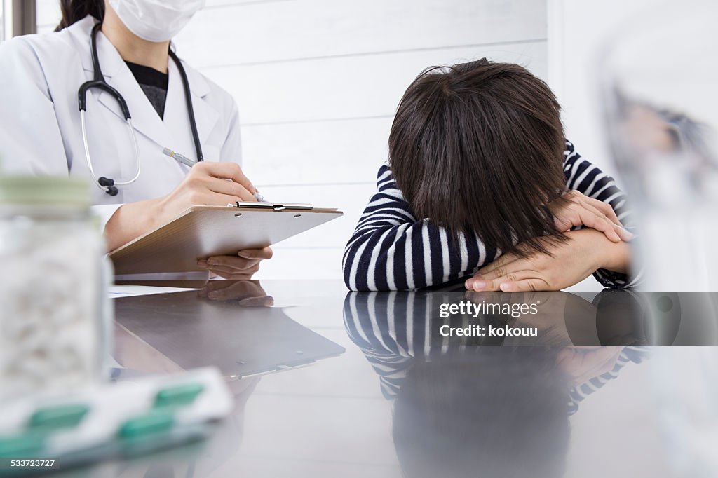 Pediatrician checking the state of the patient