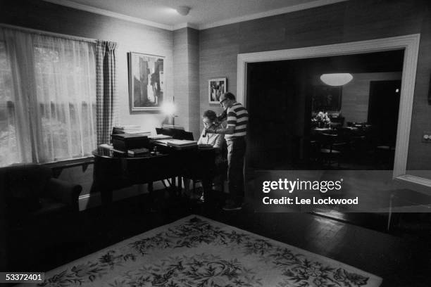 Chef Julia Child and her husband, Paul giving informal recital in their home.