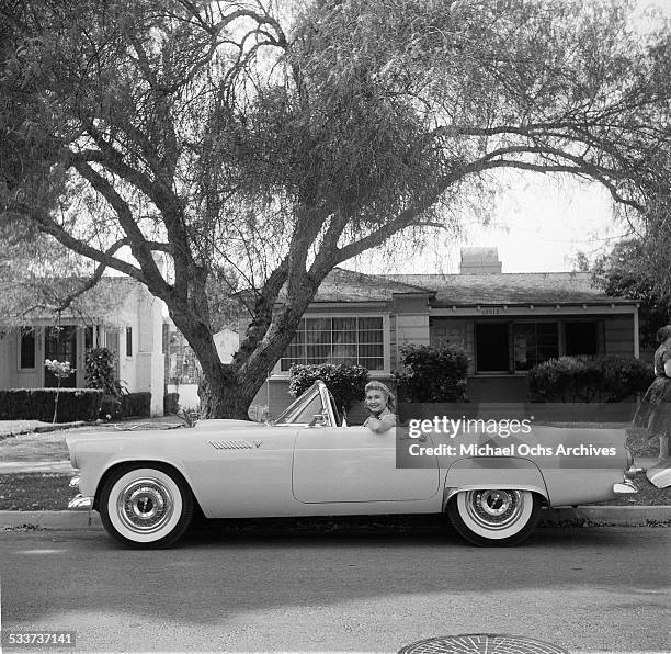 Actress Lori Nelson poses in her Ford Thunderbird car at home in Los Angeles,CA.