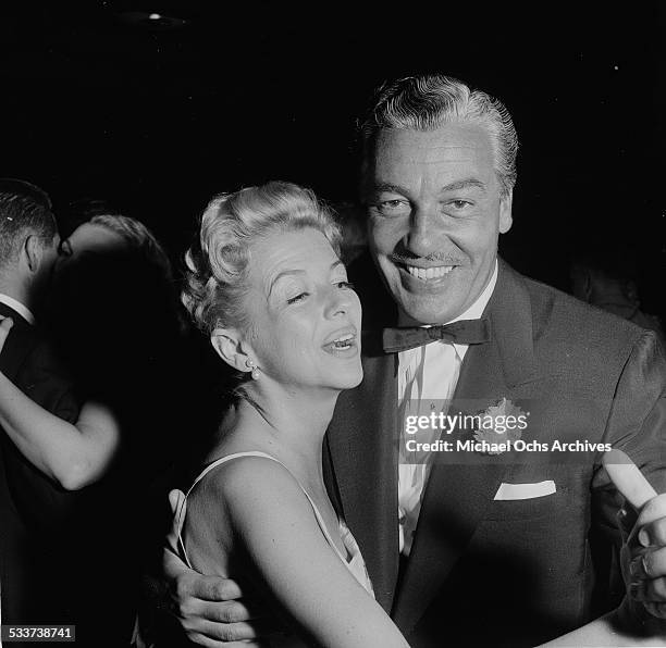 Actor Cesar Romero and Ann Sothern dance as they attend Sammy Davis Jr. Performing at Ciro's in Los Angeles,CA.