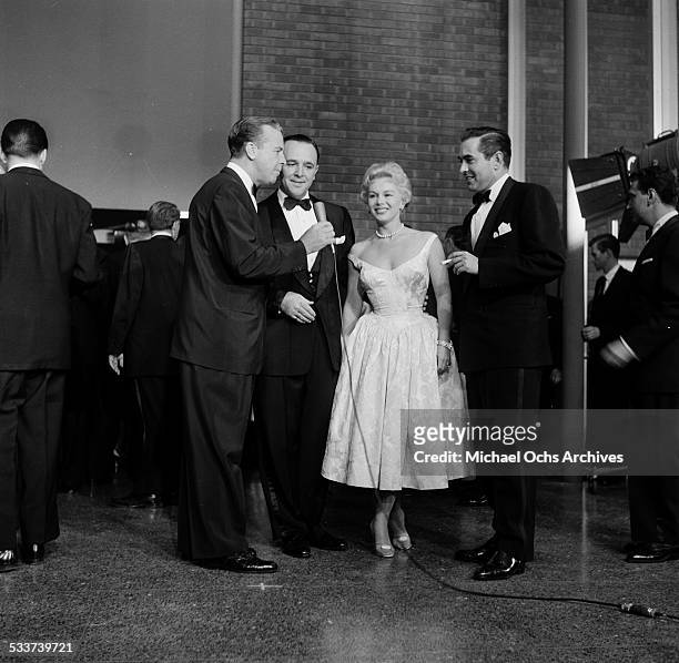 Actor Tyrone Power with actress Eva Gabor are interviewed before the Screen Directors Awards in Los Angeles,CA.
