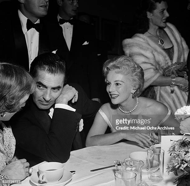 Actor Tyrone Power sits next to actress Eva Gabor during the Screen Directors Awards in Los Angeles,CA.