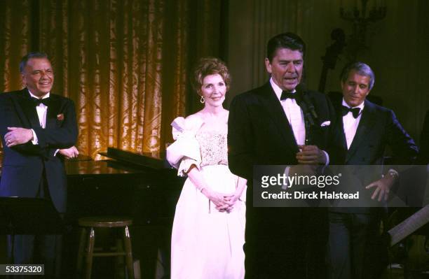 Entertainer Frank Sinatra, First Lady Nancy Reagan, President Ronald Reagan & singer Perry Como during an appearance at a State Dinner for Italy's...