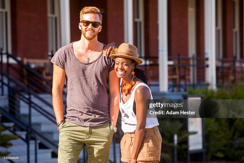 Laughing couple walking outdoors