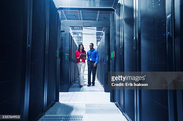 business people talking in server room - server stock pictures, royalty-free photos & images
