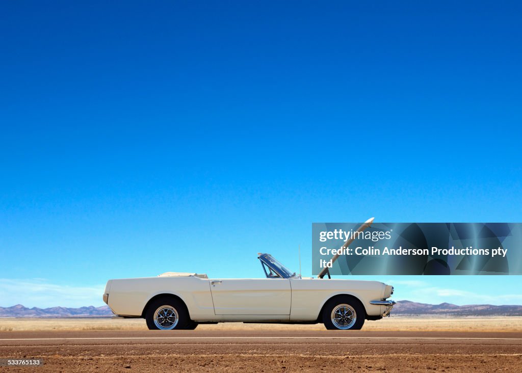 Broken down convertible abandoned on remote road