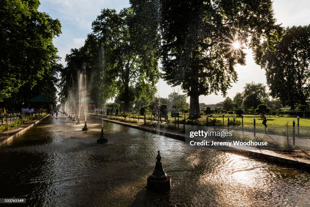 Spraying fountains in park pond