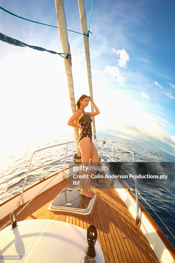 Caucasian woman standing on yacht deck