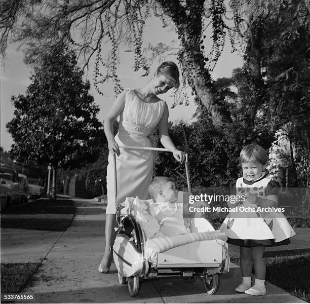 Actress Debbie Reynolds takes a walk with her children Carrie Fisher and Todd Fisher at home in Los Angeles,CA.