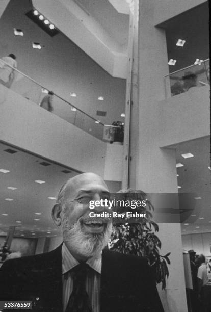 Smiling photo of Stanley Marcus, founder of Neiman Marcus department stores, probably in one of his stores.
