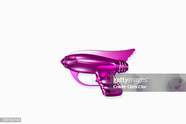 close up of futuristic purple laser gun - space weapon stock pictures, royalty-free photos & images