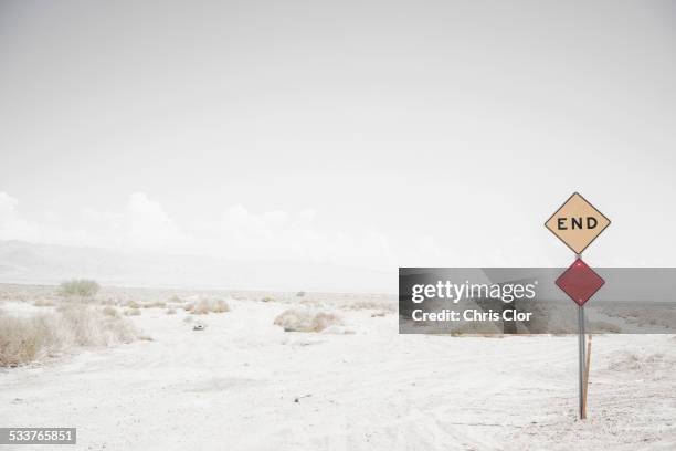 end road sign on remote dirt road - dead end stock-fotos und bilder