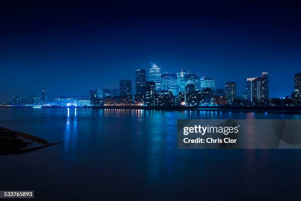 illuminated skyline in cityscape at night, london, england, united kingdom - distant stock pictures, royalty-free photos & images