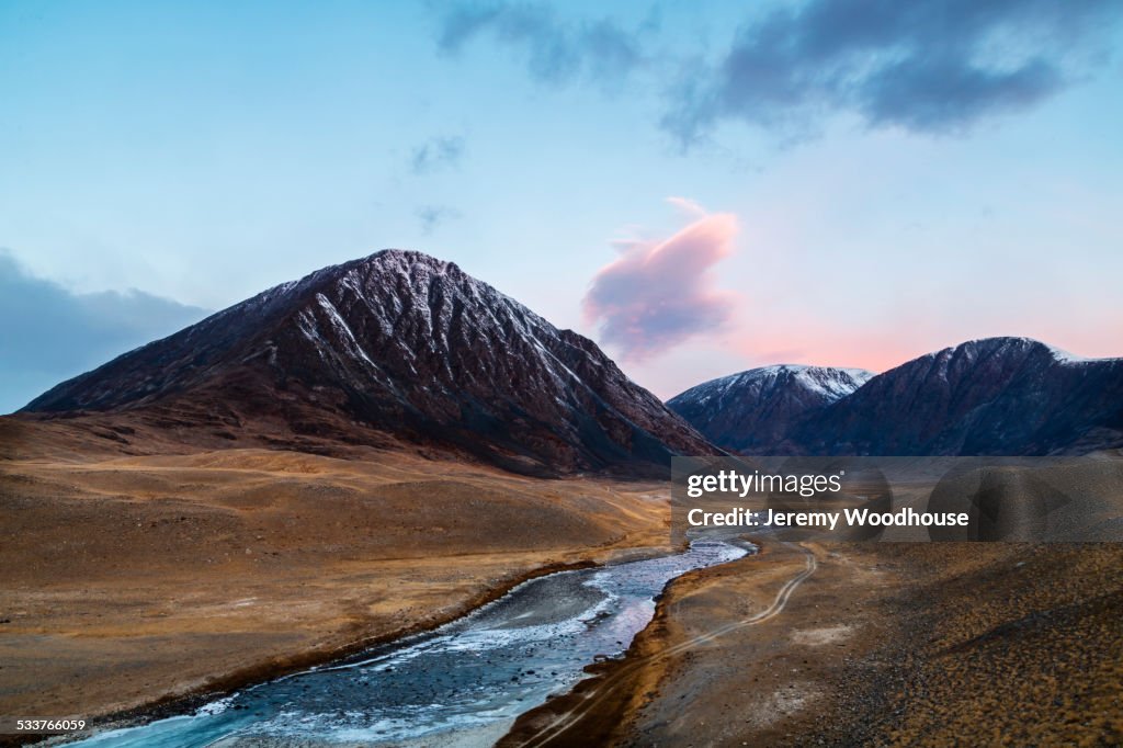 Mountains over river in remote landscape