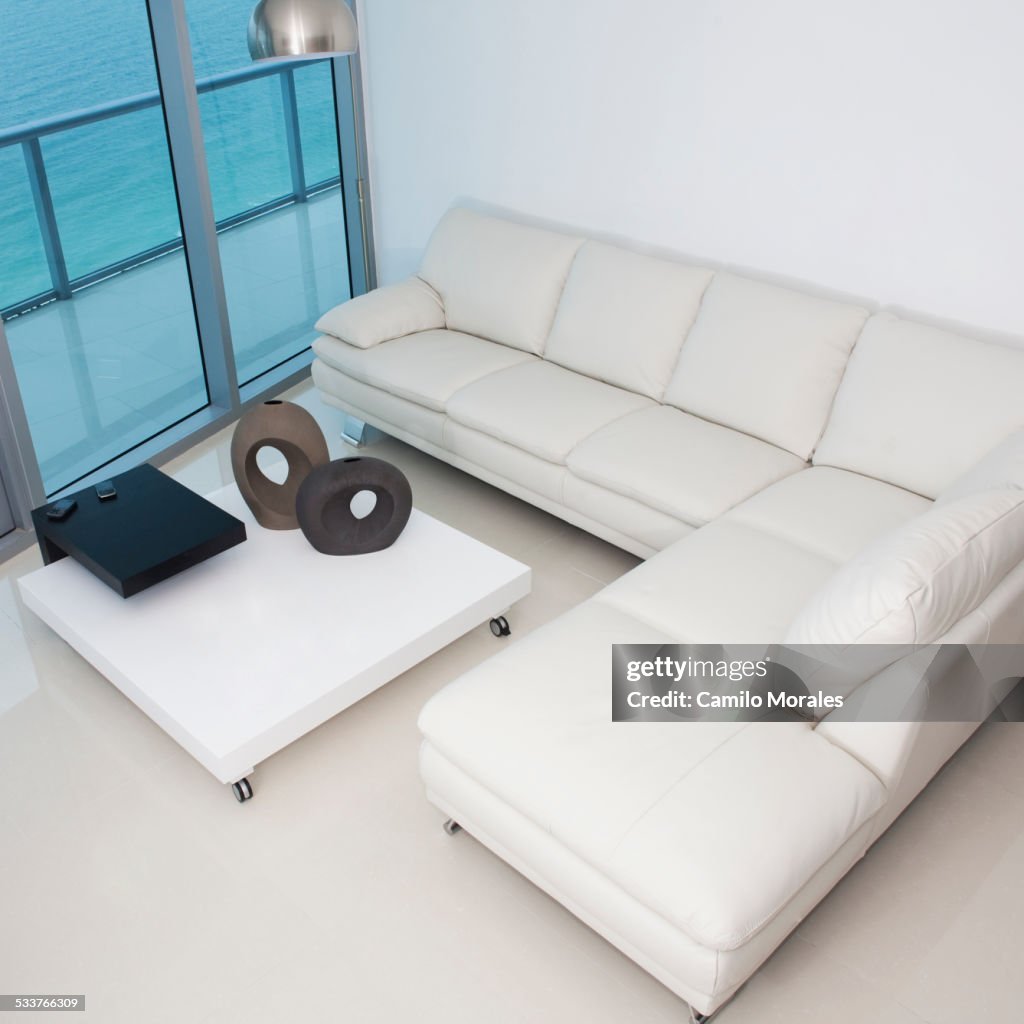 High angle view of sofa and coffee table in modern living room