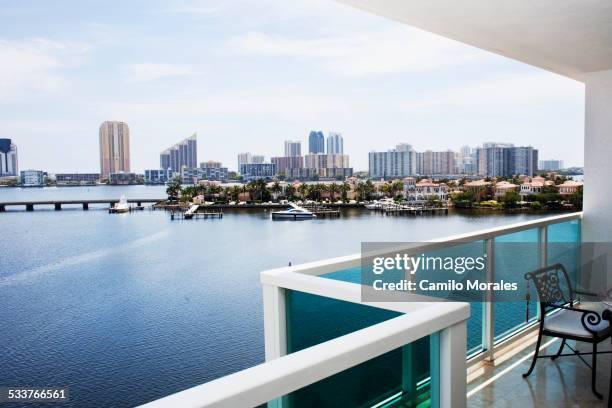 modern balcony overlooking city skyline, miami, florida, united states - modern apartment balcony stockfoto's en -beelden