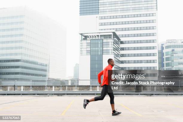 African American runner jogging in city