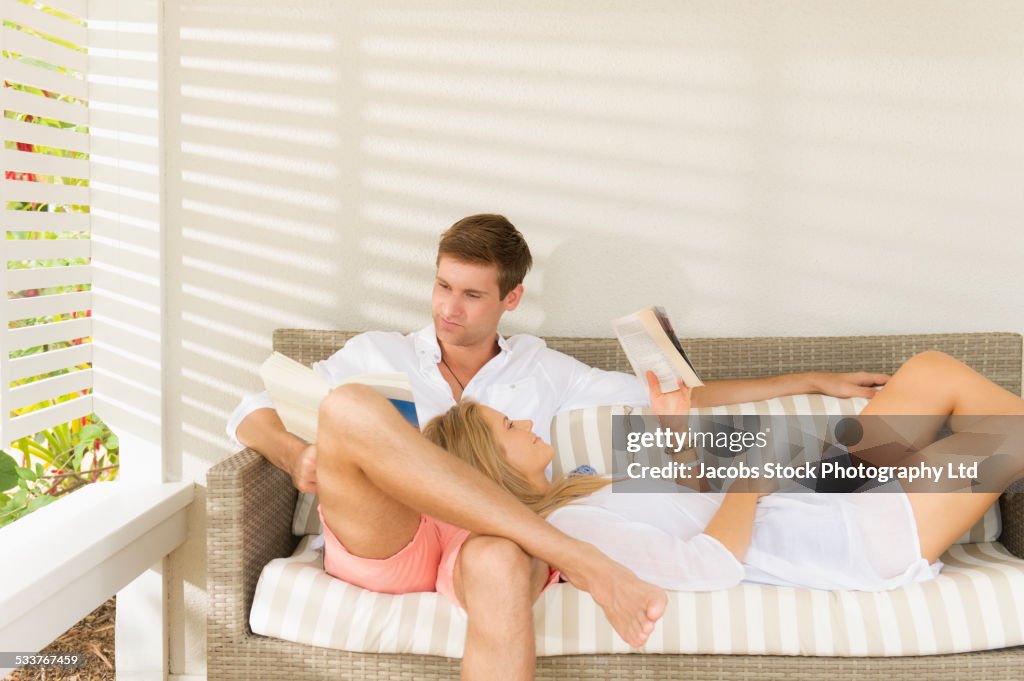 Caucasian couple relaxing on sofa