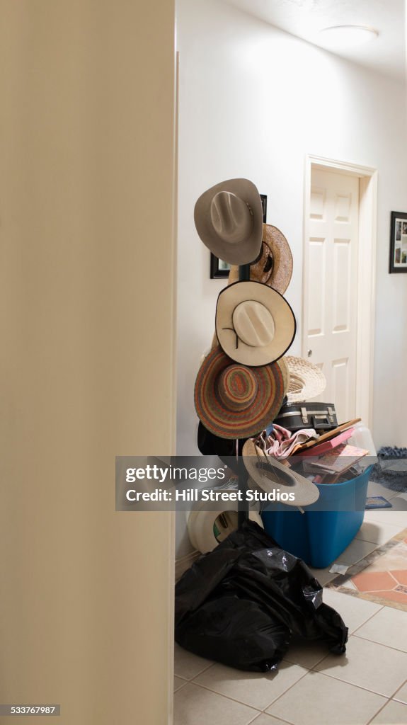 Cowboy hats hanging on hat rack