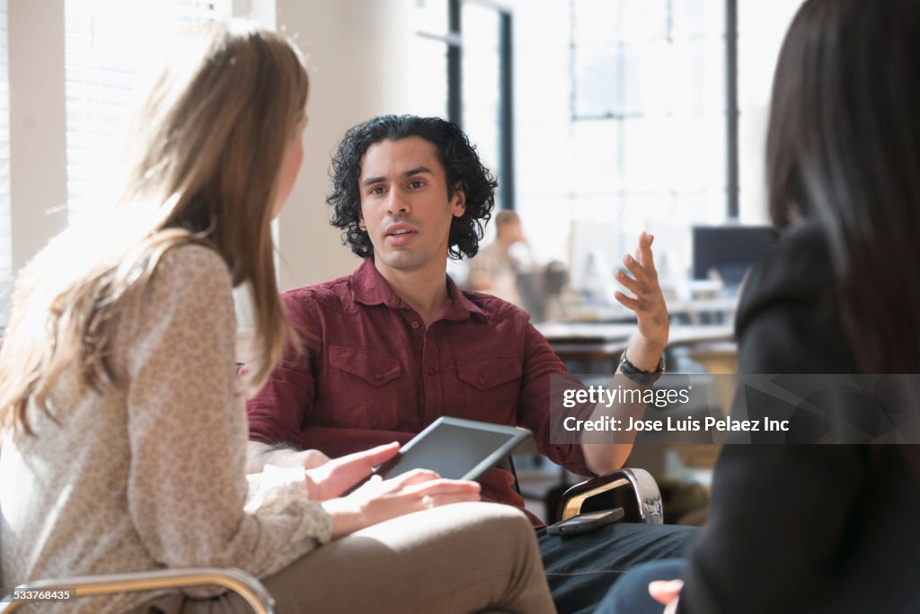 Business people talking in office meeting