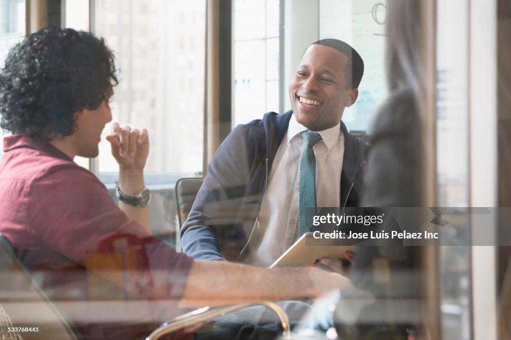 Business people talking in office meeting