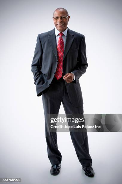 black businessman smiling - man in black suit full body stock pictures, royalty-free photos & images