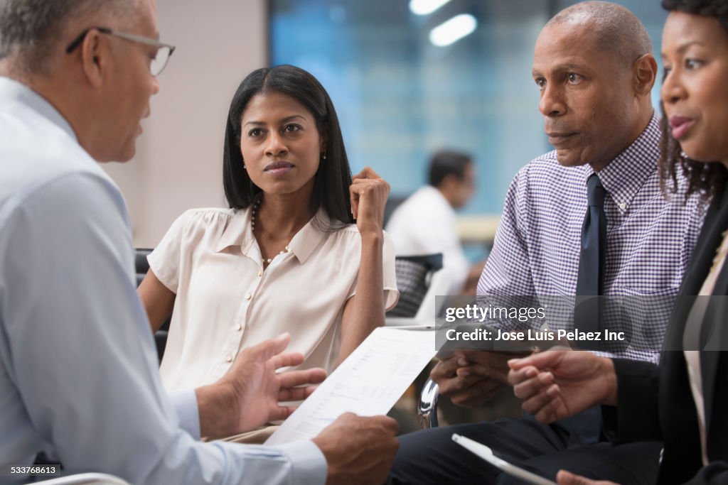 Business people talking in office meeting