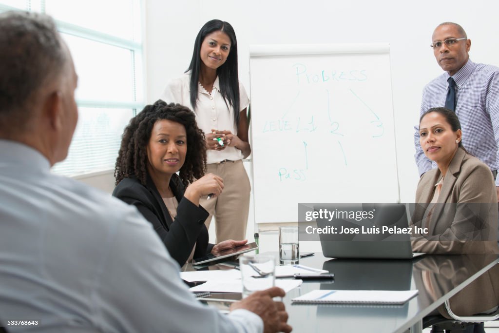 Business people talking in office meeting