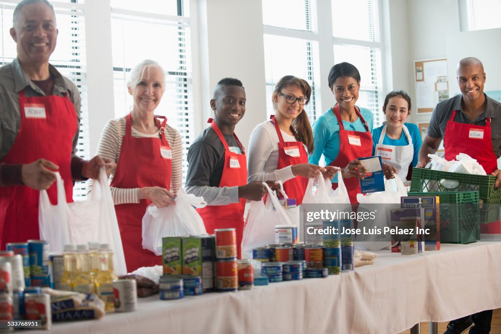 Volunteers packing canned goods at food drive