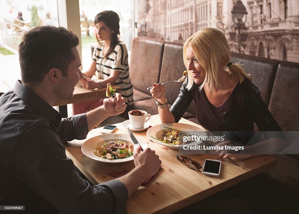 Couple eating in cafe
