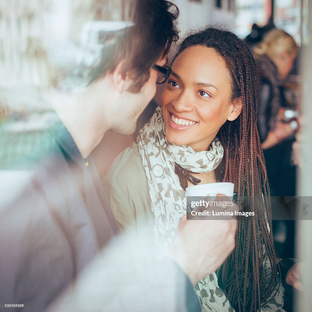 Couple drinking coffee in cafe