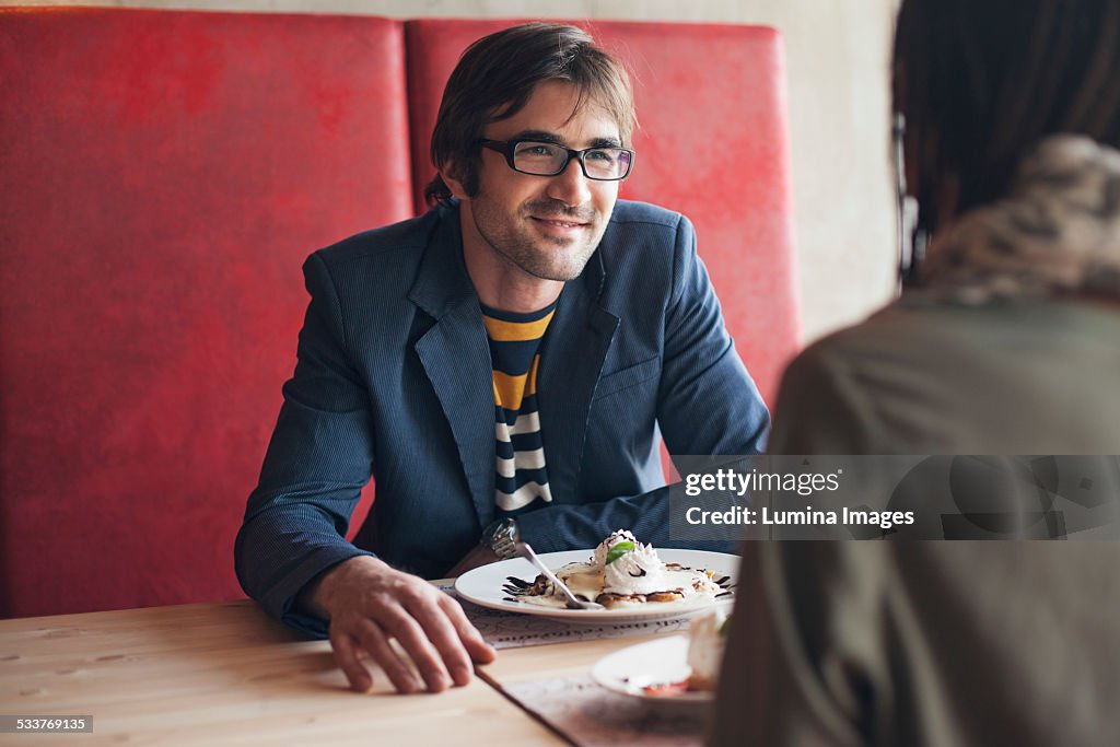 Couple eating in cafe