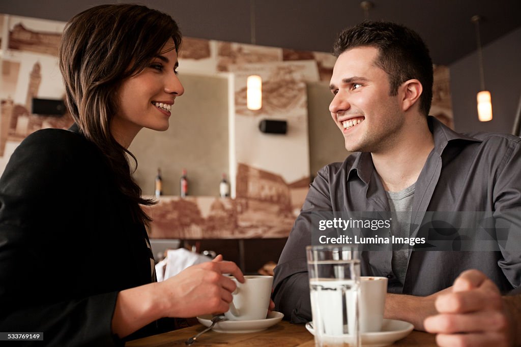 Couple drinking coffee in cafe