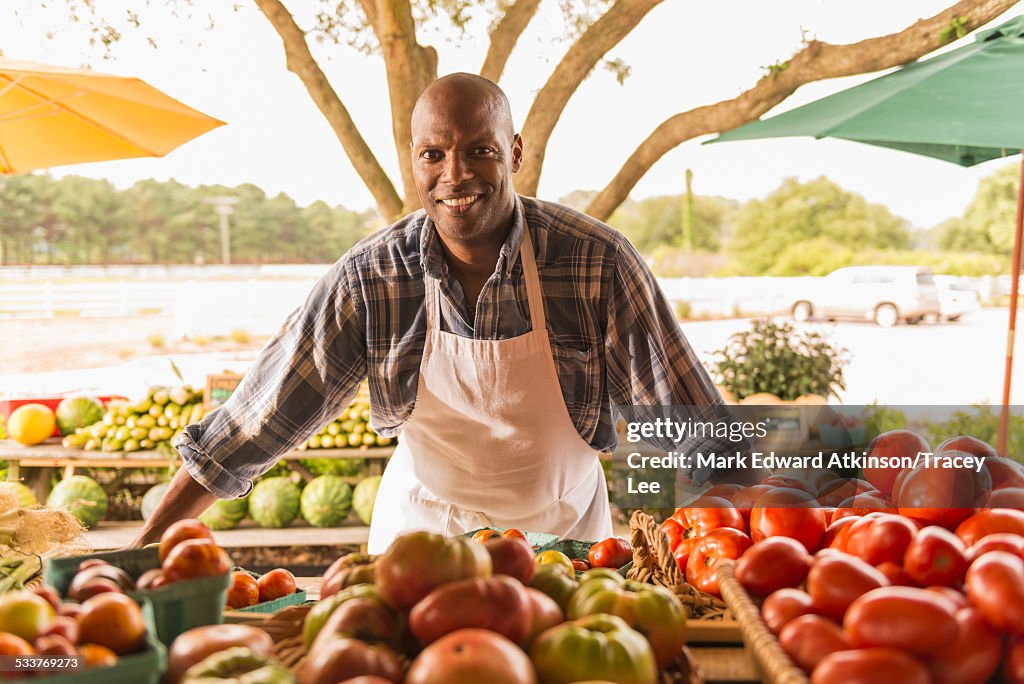 African American vendor smiling at farmers market
