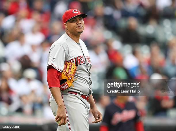 Alfredo Simon of the Cincinnati Reds reacts after giving up a hit during the fourth inning of the interleague game against the Cleveland Indians on...
