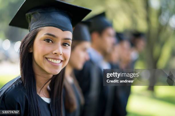 woman on her graduation day - graduates stock pictures, royalty-free photos & images