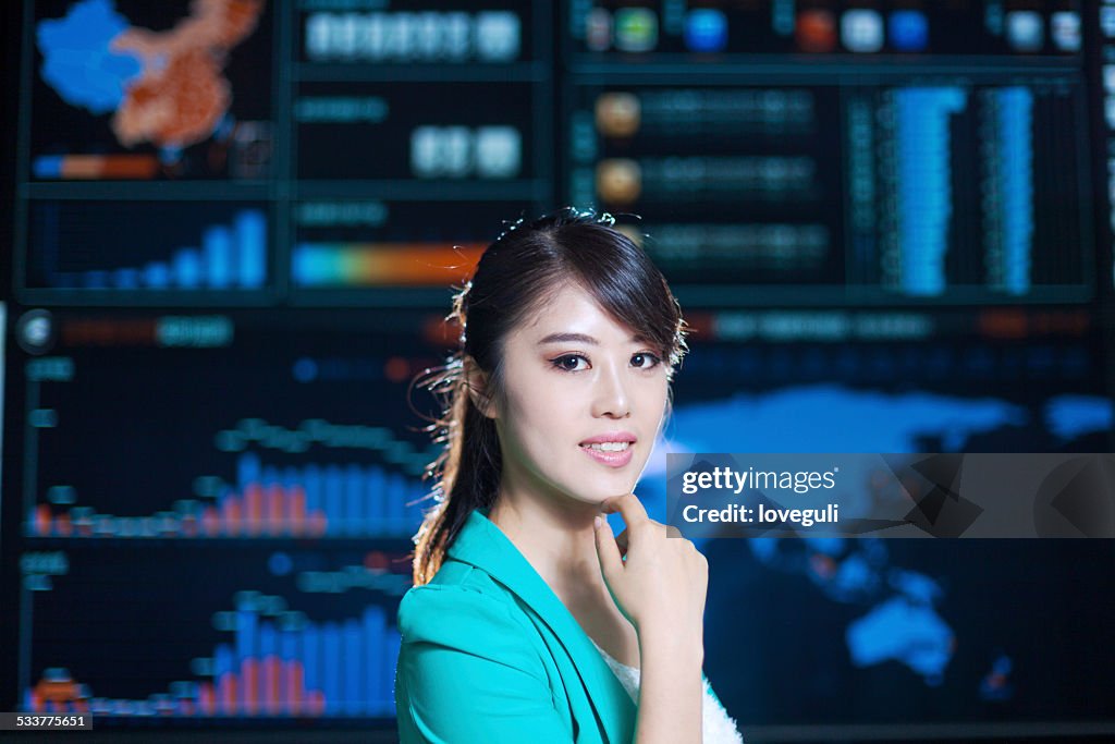 Asian successful office lady portrait with digital chart graph background