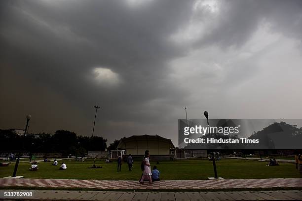 Dark clouds hover in sky after dust storm at Connaught Place on May 23, 2016 in New Delhi, India. Sudden rains brought respite for people in capital...