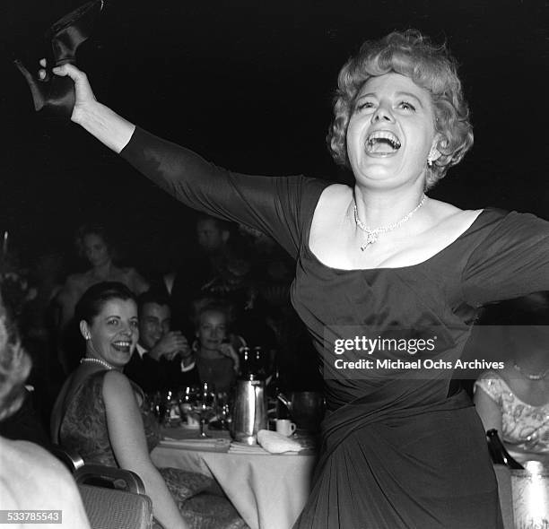 Actress Shelley Winters dances as Donnie Brooks sings during the 34th Academy Awards after party in Los Angeles,CA.