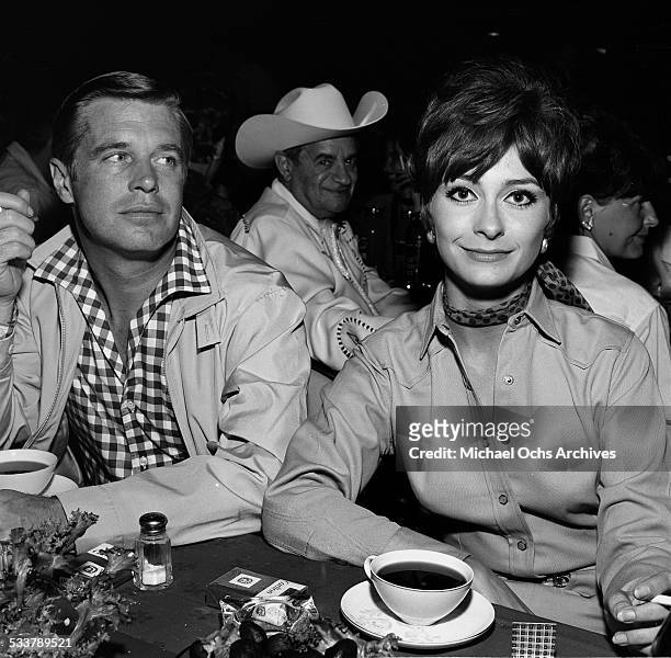 Actress Elizabeth Ashley sits with George Peppard during an event in Los Angeles,CA.