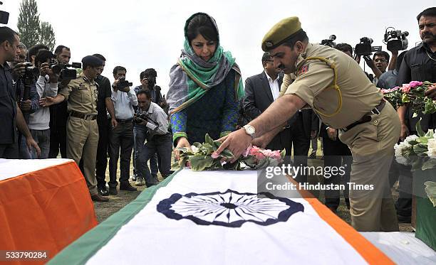 Jammu and Kashmir Chief Minister Mehbooba Mufti laying a wreath to pay tributes to the three serving policemen of Jammu & Kashmir force who were...