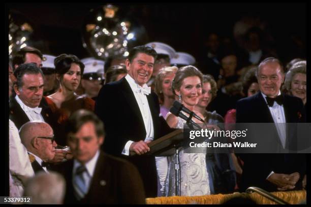 President and Nancy Reagan at podium at inaugural gala, Kennedy Center; Bob Hope & wife Patti Reagan Omar Bradley, lower right.