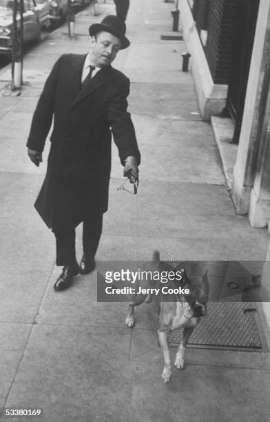 Nathaniel Benchley walking his dog.