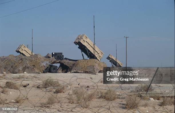 Cannisters containing Patriot missiles standing at the ready in remote desert location to intercept Iraqi Scud missiles fired at Saudi Arabia or its...