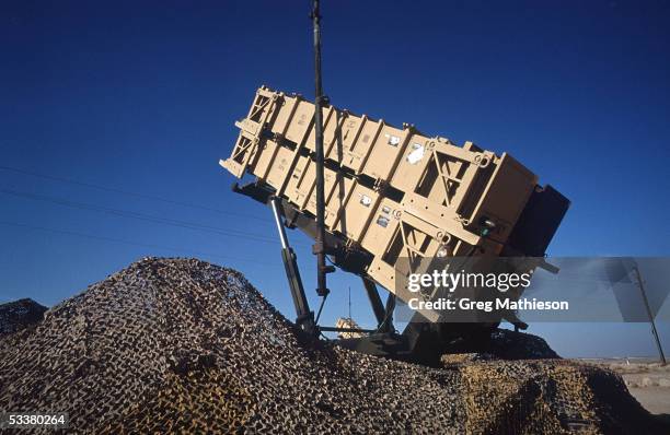 Cannisters containing Patriot missiles standing at the ready in remote desert location to intercept Iraqi Scud missiles fired at Saudi Arabia or its...